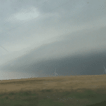 Lots of energy coming out of the El Reno supercell. Video capture from the south looking across wind farm near Union City