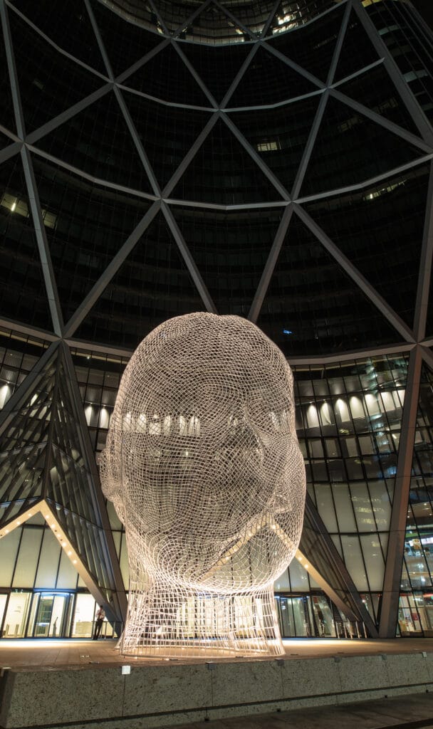 Head Statue in front of a building in downtown Calgary